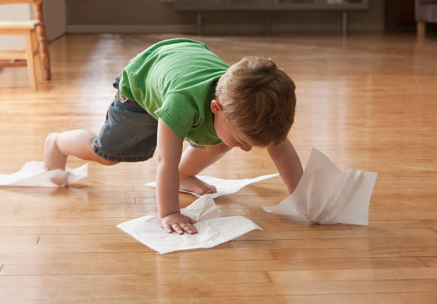 Kid playing on hardwood floor